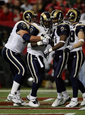 ATLANTA - DECEMBER 28:  Running back Steven Jackson #39 of the St. Louis Rams is congratulated by tackle Adam Goldberg #73, wide receivers Donnie Avery #17 and Dane Looker #89 after Jackson scored against the Atlanta Falcons at Georgia Dome on December 28