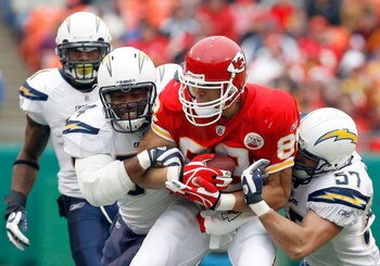 KANSAS CITY, MO - DECEMBER 14:  Tony Gonzalez #88 of the Kansas City Chiefs is tackled by Stephen Cooper #54 and Matt Wilhelm #57 of the San Diego Chargers during the first half on December 14, 2008 at Arrowhead Stadium in Kansas City, Missouri.  (Photo b