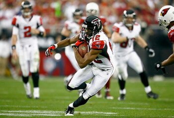 GLENDALE, AZ - JANUARY 03:  Wide receiver Michael Jenkins #12 of the Atlanta Falcons carries the ball after a reception in the NFC Wild Card Game against the Arizona Cardinals on January 3, 2009 at University of Phoenix Stadium in Glendale, Arizona. The C