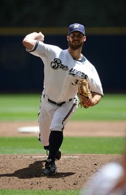 MILWAUKEE - MAY 14: Starting pitcher Dave Bush #31 of the Milwaukee Brewers delivers the ball against the Florida Marlins on May 14, 2009 at Miller Park in Milwaukee, Wisconsin. The Brewers defeated the Marlins 5-3. (Photo by Jonathan Daniel/Getty Images)