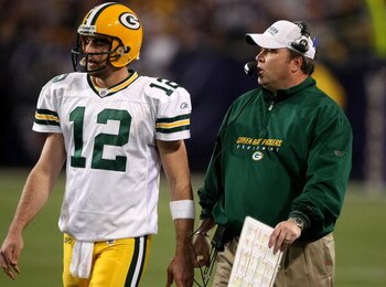 MINNEAPOLIS - NOVEMBER 09:  Quarterback Aaron Rodgers #12 and head coach Mike McCarthy of the Green Bay Packers confer against the Minnesota Vikings on November 9, 2008 at the Metrodome in Mineapolis, Minnesota.  The Vikings won 28-27.  (Photo by Stephen 