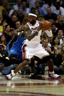 CLEVELAND - MAY 28:  LeBron James #23 of the Cleveland Cavaliers handles the ball against Mickael Pietrus #20 of the Orlando Magic in Game Five of the Eastern Conference Finals during the 2009 Playoffs at Quicken Loans Arena on May 28, 2009 in Cleveland, 