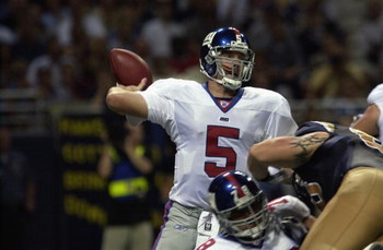 ST.LOUIS - SEPTEMBER 15:  Quarterback Kerry Collins #5 of the New York Giants prepares to throw in the second quarter against the St. Louis Rams  on September 15, 2002 at the Edward Jones Dome in St. Louis, Missouri. (Photo by Mary Butkus/Getty Images)