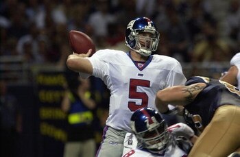 ST.LOUIS - SEPTEMBER 15:  Quarterback Kerry Collins #5 of the New York Giants prepares to throw in the second quarter against the St. Louis Rams  on September 15, 2002 at the Edward Jones Dome in St. Louis, Missouri. (Photo by Mary Butkus/Getty Images)