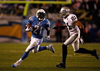 SAN DIEGO - DECEMBER 04:  Running Back LaDainian Tomlinson #21 of the San Diego Chargers is pursued by Nnamdi Asomugha #21 of the Oakland Raiders during their NFL Game on December 4, 2008 at Qualcomm Stadium in San Diego, California.  (Photo by Harry How/