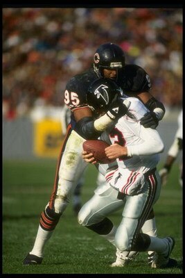 11 Nov 1990: Defensive lineman Richard Dent of the Chicago Bears sacks Atlanta Falcons quarterback Chris Miller during a game at Soldier Field in Chicago, Illinois. The Bears won the game, 30-24.