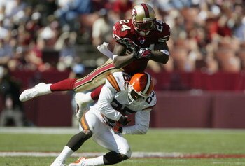 SAN FRANCISCO - SEPTEMBER 21:  Cornerback Mike Rumph #24 of the San Francisco 49ers collides with wide receiver Kevin Johnson #85 of the Cleveland Browns at Candlestick Park on September 21, 2003 in San Francisco, California. The Browns defeated the 49ers