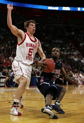 MIAMI - MARCH 20:  Guard Nic Wise #13 (R) of the University of Arizona Wildcats drives around guard Luka Drca  #5 (L) of the University of Utah Runnin' Utes  during the first round of the NCAA Division I Men's Basketball Tournament at the American Airline