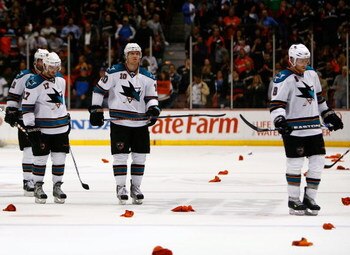 ANAHEIM, CA - APRIL 27:  Torrey Mitchell #17, Christian Ehrhoff #10 and Joe Pavelski #8 of the San Jose Sharks skate off the ice after being eliminated from the playoffs by the Anaheim Ducks in Game Six of the Western Conference Quarterfinal Round of the 