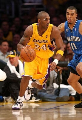 LOS ANGELES - JANUARY 16:  Kobe Bryant #24 of the Los Angeles Lakers dribbles the ball during their NBA game against the Orlando Magic on January 16, 2009 at Staples Center in Los Angeles, California. The Magic won 109-103.   NOTE TO USER: User expressly 