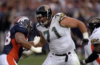 25 Oct 1998: Tony Boselli #71 of the Jacksonville Jaguars pushes Maa Tanuvasa #98 of the Denver Broncos at Mile High Stadium in Denver, Colorado. The Broncos defeated the Jaguars 37- 24.