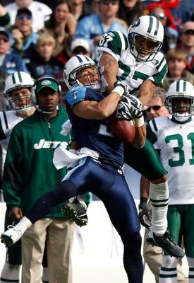 NASHVILLE, TN - NOVEMBER 23:  Cortland Finnegan #31 of the Tennessee Titans intercepts this pass intended for Laveranues Coles #87 of the New York Jets during the game at LP Field on November 23, 2008 in Nashville, Tennessee.  (Photo by Kevin C. Cox/Getty