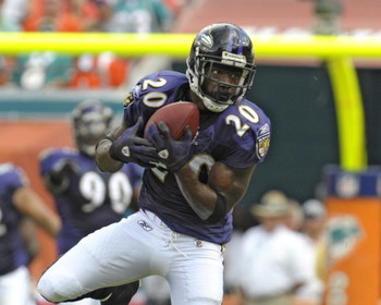 MIAMI, FL - JANUARY 4: Safety Ed Reed #20 of the Baltimore Ravens intercepts a pass against the Miami Dolphins in an AFC wild card game at Dolphins Stadium January 4, 2009 in Miami, Floirda. Reed ran the interception back for a touchdown. (Photo by Al M