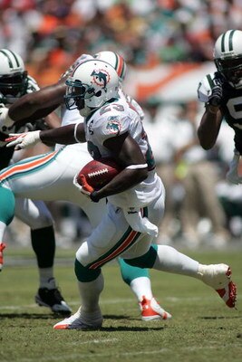 MIAMI - SEPTEMBER 07:  Ronnie Brown #23 of the Miami Dolphins runs the ball against the New York Jets at Dolphin Stadium on September 7, 2008 in Miami, Florida. The Jets won 20-14. (Photo by Marc Serota/Getty Images)