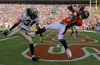 DENVER - SEPTEMBER 21:  Wide receiver Eddie Royal #19 of the Denver Broncos is unable to stay inbounds as he makes a reception in the endzone as corner back Mike McKenzie #34 of the New Orleans Saints defends during NFL action at Invesco Field at Mile Hig