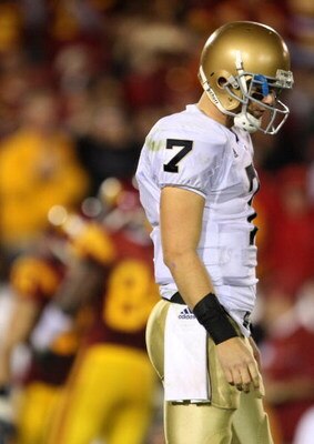 LOS ANGELES, CA - NOVEMBER 29:  Quarterback Jimmy Clausen #7 of the Notre Dame Fighting looks down during the first half against the USC Trojans at the Memorial Coliseum on November 29, 2008 in Los Angeles, California. USC defeated Notre Dame 38-3.  (Phot