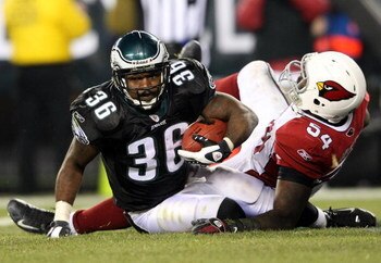 PHILADELPHIA - NOVEMBER 27:  Brian Westbrook #36 of the Philadelphia Eagles scores a touchdown despite the tackle from Gerald Hayes #54 of the Arizona Cardinals at Lincoln Financial Field on November 27, 2008 in Philadelphia, Pennsylvania.  (Photo by Nick