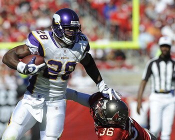 TAMPA, FL - NOVEMBER 16: Running back Adrian Peterson #28 of the Minnesota Vikings rushes upfield against the Tampa Bay Buccaneers at Raymond James Stadium on November 16, 2008 in Tampa, Florida.  (Photo by Al Messerschmidt/Getty Images) 