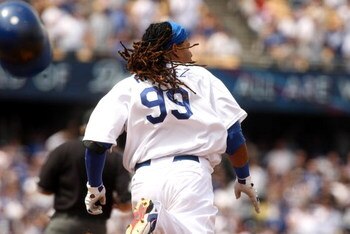 LOS ANGELES, CA - APRIL 13:  Manny Ramirez #99 of he Los Angeles Dodgers runs the bases as he hits a double against the San Francisco Giants on April 13, 2009 at Dodger Stadiium in Los Angeles, California.  (Photo by Stephen Dunn/Getty Images)