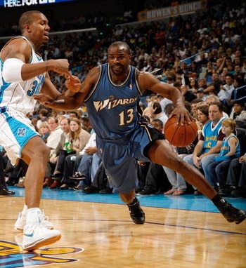 NEW ORLEANS - DECEMBER 30:  Mike James #13 of the Washington Wizards drives the ball around David West #30 of the New Orleans Hornets on December 30, 2008 at the New Orleans Arena in New Orleans, Louisiana.  NOTE TO USER: User expressly acknowledges and a