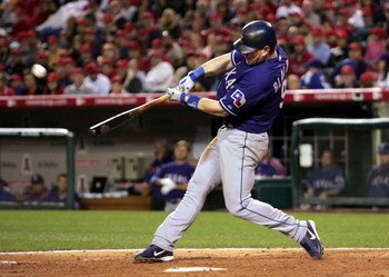 ANAHEIM, CA - APRIL 11:  Hank Blalock #9 of the Texas Rangers hits his second home run of the game against the Los Angeles Angels of Anaheim in the fourth inning on April 11, 2006 at Angel Stadium in Anaheim, California.  (Photo by Stephen Dunn/Getty Imag