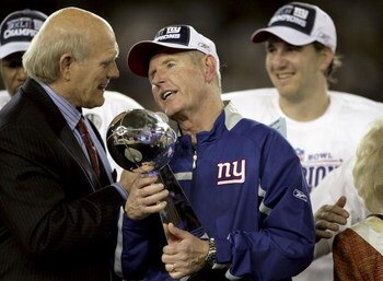 GLENDALE, AZ - FEBRUARY 03:  Head coach TOm Coughlin of the New York Giants holds the Vince Lombardi Trophy as he is interviewed by Terry Bradshaw after his team defeated the New England Patriots 17 0 14 after Super Bowl XLII on February 3, 2008 at the Un