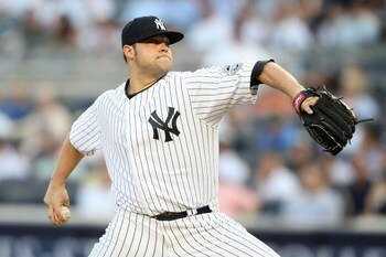 NEW YORK - MAY 21: Joba Chamberlain #62 of the New York Yankees pitches against the Baltimore Orioles on May 21, 2009 at Yankee Stadium in the Bronx borough of New York City.  (Photo by Nick Laham/Getty Images)