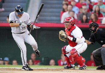 ANAHEIM, CA - OCTOBER 15: Tadahito Iguchi #15 of the Chicago White Sox reacts to being hit by a pitch by Ervin Santana #54 of the Los Angeles Angels of Anaheim in Game Four of the American League Championship Series on October 15, 2005 at Angel Stadium in