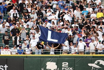 CHICAGO - JUNE 27:  Fans of the Chicago White Sox hold up a flag with the letter 'L' on it signifing the 10-3 loss by the Chicago Cubs at U.S. Cellular Field on June 27, 2008 in Chicago, Illinois.  (Photo by Jonathan Daniel/Getty Images)