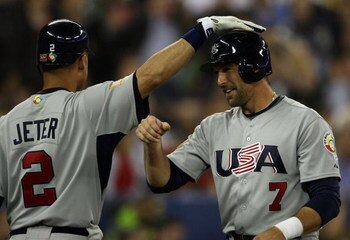 TORONTO, ON - MARCH 08:  Mark DeRosa #7 of the USA is congratulated by teammate Derek Jeter #2 after DeRosa scored in the sixth inning against Venezuela during the 2009 World Baseball Classic Pool C match on March 8, 2009 at the Rogers Centre in Toronto, 