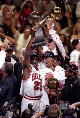 13 Jun 1997:  Michael Jordan #23 and Scottie Pippen #33 of the Chicago Bulls celebrate with the trophy after winning game 6 of the 1997 NBA Finals at the United Center in Chicago, Illinois. The Bulls defeated the Jazz 90-86 to win the series and claim the