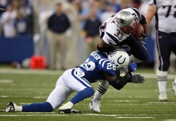 INDIANAPOLIS - NOVEMBER 04:  Kevin Faulk #33 of the New England Patriots runs with the ball against Marlin Jackson #28 of the Indianapolis Colts on November 4, 2007 at the RCA Dome in Indianapolis, Indiana.  (Photo by Andy Lyons/Getty Images)