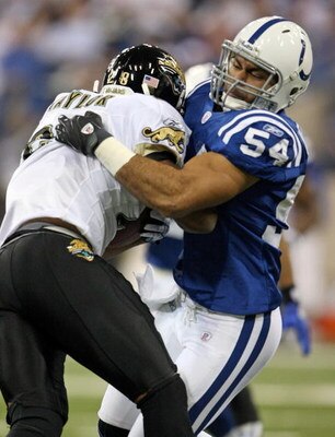 INDIANAPOLIS - DECEMBER 02: Freddy Keiaho #54 of the Indianapolis Colts tackles Fred Taylor #28 of the Jacksonville Jaguars during the NFL game against  on December 2, 2007 at the RCA Dome in Indianapolis, Indiana.  (Photo by Andy Lyons/Getty Images)  
