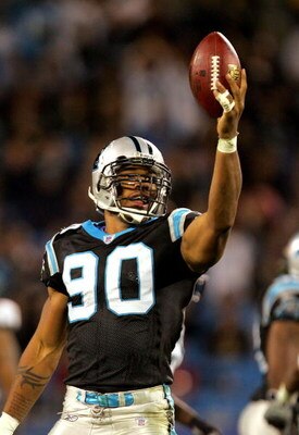 CHARLOTTE, NC - NOVEMBER 13:  Julius Peppers #90 of the Carolina Panthers celebrates after recovering a fumble during their game against the Tampa Bay Buccaneers on November 13, 2006 at Bank of America Stadium in Charlotte, North Carolina. The Panthers de