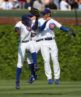 CHICAGO - MAY 29: (L-R) Alfonso Soriano #12, Reed Johnson #9 and Kosuke Fukudome #1 of the Chicago Cubs celebrate a win over the Los Angeles Dodgers on May 29, 2009 at Wrigley Field in Chicago, Illinois. The Cubs defeated the Dodgers 2-1. (Photo by Jonath