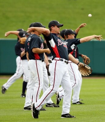 KISSIMMEE, FL - FEBRUARY 25:  Chipper Jones #10 of the Atlanta Braves and the rest of his teammates throw the ball during practice on February 25, 2008 at Disney's Wide World of Sports in Kissimmee, Florida.  (Photo by Elsa/Getty Images)
