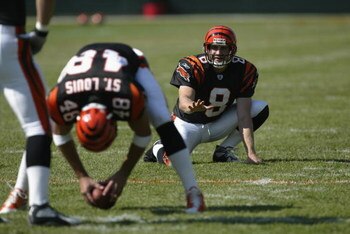 CINCINNATI - SEPTEMBER 29:  Kick holder Nick Harris #8 of the Cincinnati Bengals looks to receive the football from teammate long snapper Brad St. Louis #48 during warms ups before the game against the Tampa Bay Buccaneers on September 29, 2002 at Paul Br