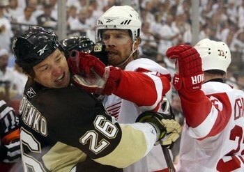 PITTSBURGH - JUNE 04:  Mikael Samuelsson #37 of the Detroit Red Wings checks Ruslan Fedotenko #26 of the Pittsburgh Penguins during Game Four of the 2009 NHL Stanley Cup Finals on June 4, 2009 at Mellon Arena in Pittsburgh, Pennsylvania.  (Photo by Bruce 