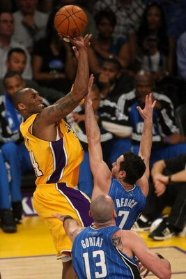 LOS ANGELES, CA - JUNE 04:  Kobe Bryant #24 of the Los Angeles Lakers puts a shot up over J.J. Redick #7 and Marcin Gortat #13 of the Orlando Magic in Game One of the 2009 NBA Finals at Staples Center on June 4, 2009 in Los Angeles, California. NOTE TO US