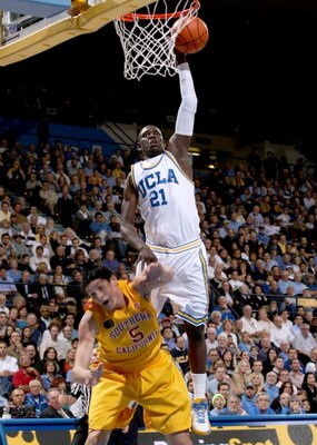 WESTWOOD, CA - FEBRUARY 04:  Jrue Holiday #21 of the UCLA Bruins shoots over Nikola Vucevic #5 of the USC Trojans on February 4, 2009 at Pauley Pavillion in Westwood, California.   UCLA won 76-60.  (Photo by Stephen Dunn/Getty Images)