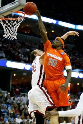 MEMPHIS, TN - MARCH 27:  Jonny Flynn #10 of the Syracuse Orange goes up for a dunk over Taylor Griffin #32 of the Oklahoma Sooners in the second half during the NCAA Men's Basketball Tournament South Regionals at the FedExForum on March 27, 2009 in Memphi
