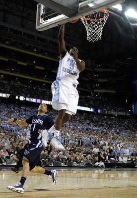 DETROIT - APRIL 04:  Ty Lawson #5 of the North Carolina Tar Heels shoots a lay up in the first half against Scottie Reynolds #1 of the Villanova Wildcats during the National Semifinal game of the NCAA Division I Men's Basketball Championship at Ford Field