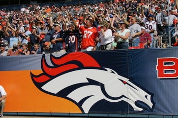 DENVER - SEPTEMBER 26:  Fans cheer on as the Denver Broncos host the San Diego Chargers on September 26, 2004 at Invesco Field in Denver, Colorado. The Broncos defeated the Chargers 23-13.  (Photo by Ronald Martinez/Getty Images)