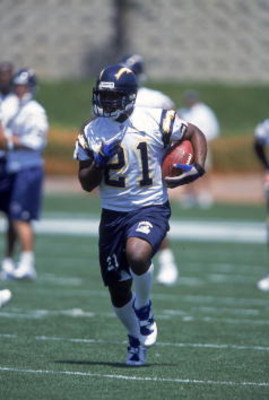 4 May 2001: LaDainian Tomlinson #21 runs with the ball during the San Diego Chargers Mini Camp at Murphy Canyon in San Diego, California.Mandatory Credit: Todd Warshaw /Allsport
