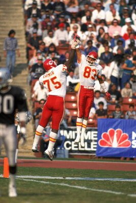LOS ANGELES - 1986:  Wide receiver Stephone Paige #83 and Irv Eatman #75 of the Kansas City Chiefs celebrate with a high five during a 1986 NFL game against the Los Angeles Raiders at the LA Memorial Coliseum in Los Angeles, California.  The Raiders defea
