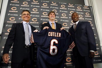 LAKE FOREST, IL - APRIL 3:  Chicago Bears general manager Jerry Angelo, quarterback Jay Cutler and head coach Lovie Smith are all smiles after introducing Cutler as their new quarterback during a press conference on April 3, 2009 at Halas Hall in Lake For