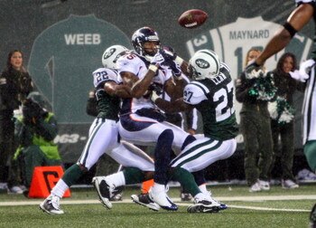 EAST RUTHERFORD, NJ - NOVEMBER 30:  Brandon Marshall #15 of the Denver Broncos can't make the catch as he defended by Ty Law #22 and Abram Elam #27 of the New York Jets on November 30, 2008 at Giants Stadium in East Rutherford, New Jersey. The Broncos def