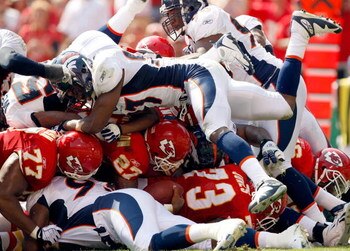 KANSAS CITY, MO - SEPTEMBER 28:  Larry Johnson #27 of the Kansas City Chiefs carries the ball up the middle at the goal line for a touchdown during the game against the Denver Broncos on September 28, 2008 at Arrowhead Stadium in Kansas City, Missouri.  (