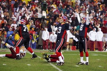LANDOVER, MD - DECEMBER 02:  Rian Lindell #9 of the Buffalo Bills watches his game winning field goal against the Washington Redskins with teammates Brian Moorman #8, and Jason Peters #71 on December 2, 2007 at FedEx Field in Landover, Maryland.  (Photo b