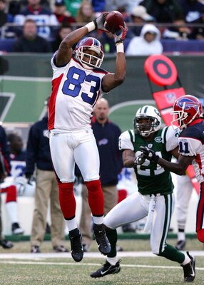 EAST RUTHERFORD, NJ - OCTOBER 28:  Lee Evans #83 of the Buffalo Bills goes up for a reception against the New York Jets at Giants Stadium October 28, 2007 in East Rutherford, New Jersey.  (Photo by Jim McIsaac/Getty Images)